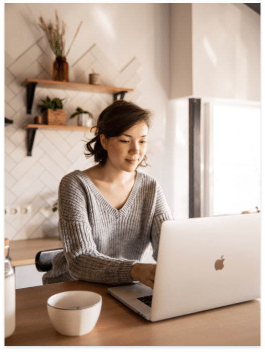 woman typing at laptop